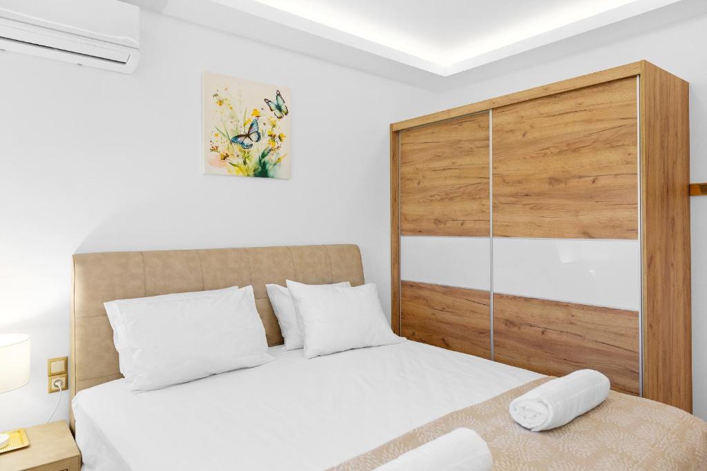 Master bedroom featuring a large double bed and natural lighting