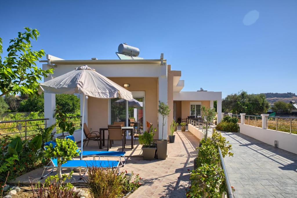 Spacious living room with modern decor at Paul's Garden luxury holiday house in Haraki